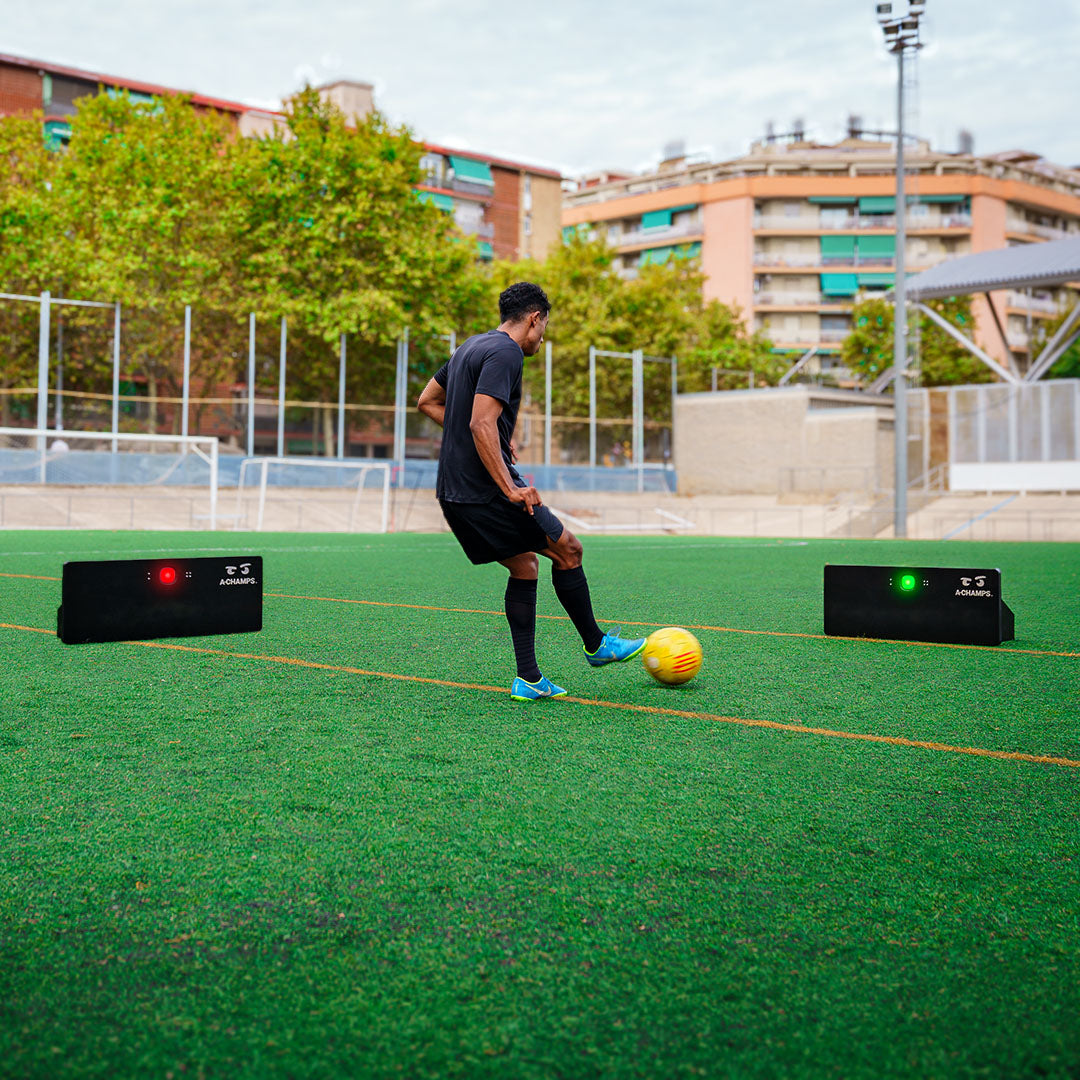 Player training with Goal Station rebounders on a pitch