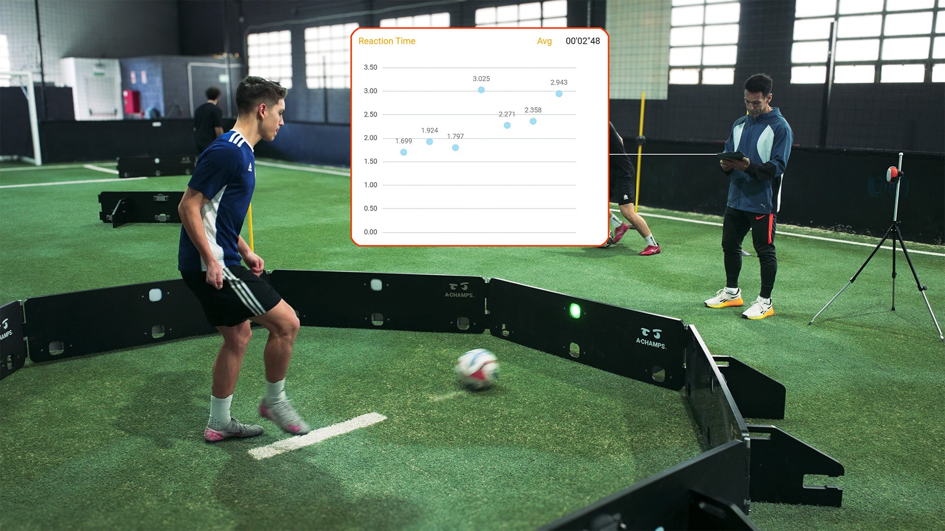 Male player using the Scanning 360 while male coach looks over statistics with pop up reaction time graph.