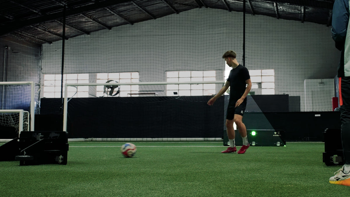 Player using a Goal Station rebounder indoors