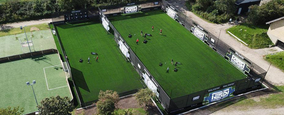 Aerial view of Goal Station Arena with people practicing inside.