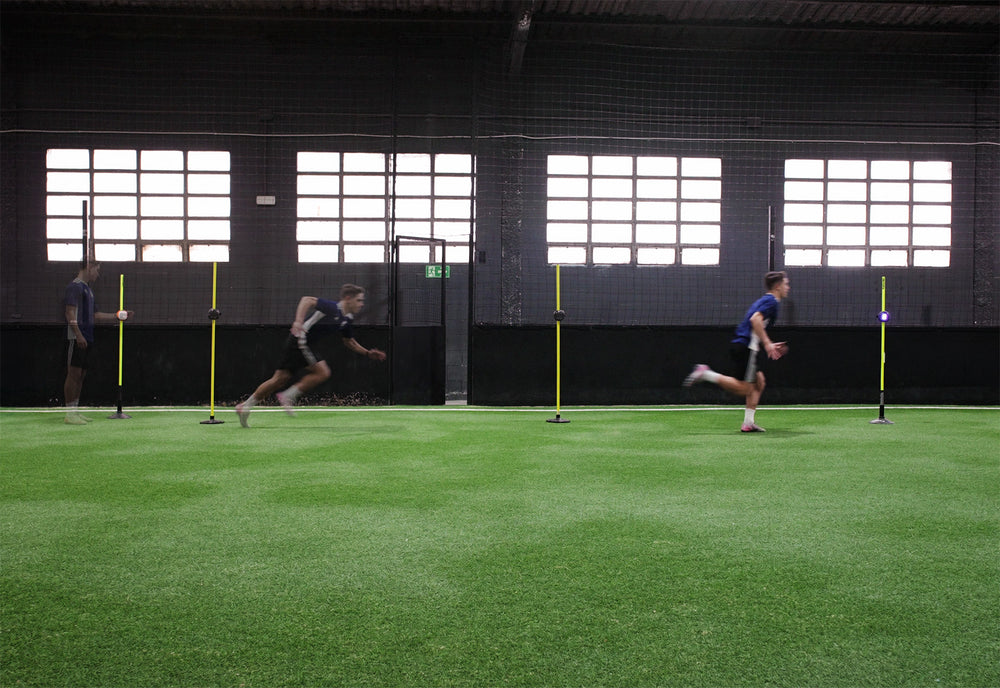 Athlete running a speed measurement drill